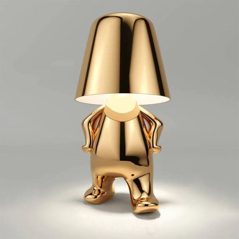 Metallic table light with reflective artistic form