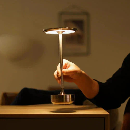 Wireless table lamp with circular metal shade